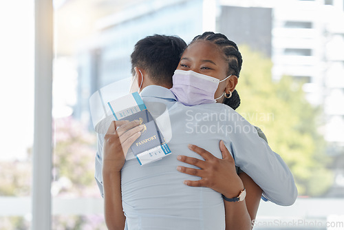 Image of Airport, travel and face mask with couple hug with covid passport before international flight abroad. Black woman with immigration, traveling and corona compliance at the border with friends farewell