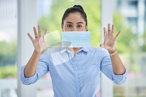 Image of Covid, face mask and business woman at the office, health and safety in the workplace. Young, corporate person in portrait and compliance of healthcare, rules and regulations policy of virus.