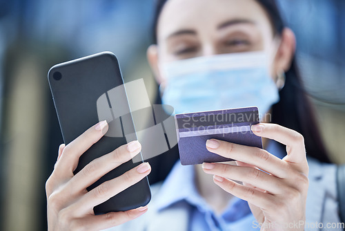 Image of Covid, phone and credit card with a woman customer online shopping using 5g mobile technology closeup. Finance, accounting and fintech with a female consumer spending money on the internet from below