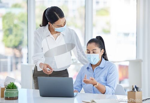 Image of Covid, work and business women in the office with laptop and wearing face mask. Tech, 404 and team working to fix problem, mistake and glitch on computer with mask in the workplace for covid 19