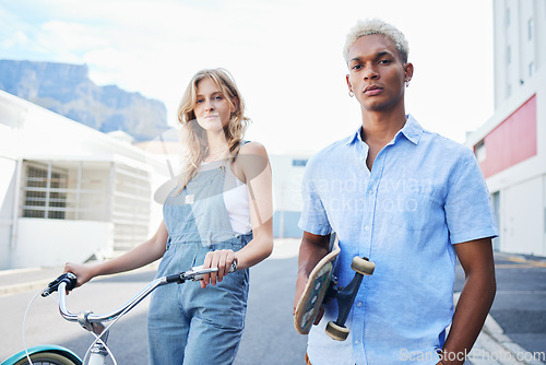 Image of Bike, skate and portrait of urban couple, gen z street fashion and outdoor activity. Young city man and woman, streetwear and alternative transport, carbon neutral travel with skateboard and bicycle.