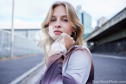 Image of Woman in city street, fashion portrait for blonde model and gen z style in New York road. Outdoor winter clothes, natural makeup beauty on face and cool caucasian girl closeup in urban lifestyle