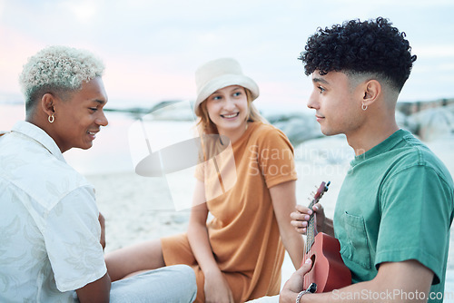 Image of Guitar, relax and friends on holiday at the beach with music from a musician in Spain during summer. Happy, young and travel people playing ukulele instrument on vacation by sea for peace and calm