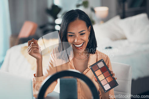 Image of Influencer recording makeup tutorial with phone, vlogging with beauty cosmetics and streaming a skincare routine at home. Entrepreneur, female blogger or happy woman making video for social media