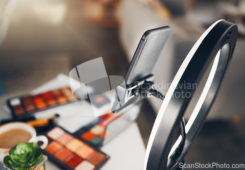 Image of Beauty blog, cosmetics and phone stand of a social media makeup vlogger ready for shooting a video. View of influencer equipment and products ready for live streaming a tutorial for web content