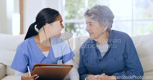 Image of Consulting, home and nurse with senior woman on sofa for medical care, support and service. Healthcare, retirement and caregiver with elderly patient documents for insurance, diagnosis and report