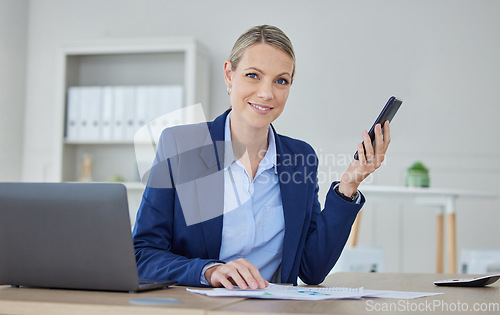 Image of Business woman, accounting executive and finance manager planning on phone while reading data, strategy and paperwork for report in an office. Portrait of a leader, analyst and worker with analytics