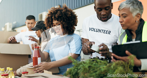 Image of Group of people, volunteer and checking food boxes on table for charity with care, kindness and help. Community donation, happy men and women at ngo with grocery checklist at non profit project event