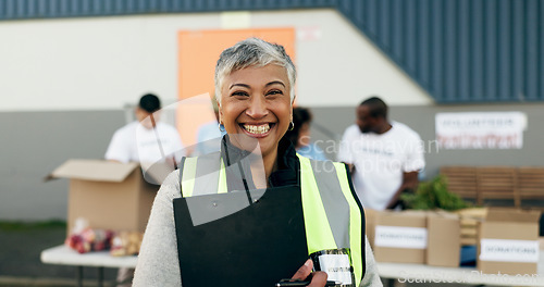 Image of Woman, clipboard and manager in charity, volunteer and organizer for outreach program, smile and portrait. Happy senior person, non profit and support in social responsibility for NGO foundation