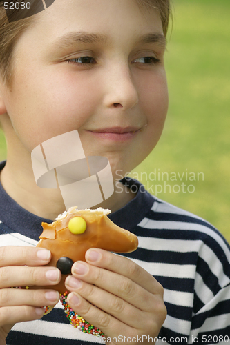 Image of Boy with a sweet treat