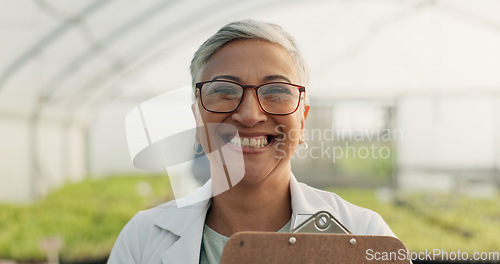 Image of Portrait, botanist and happy woman at greenhouse for science at farm, plant and checklist for ecology. Face, smile and mature scientist at nursery for agriculture in glasses for research in Mexico