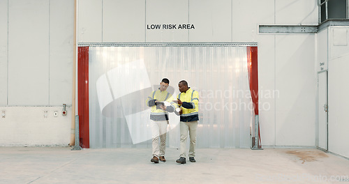 Image of Engineering, tablet and communication in warehouse for teamwork, collaboration on construction floor plan. Diversity, professional men or people for building design, factory and project management