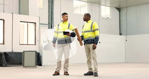 Image of Construction, tablet and men with blueprint for planning, design and meeting in building. Architecture, engineering and contractors on digital tech for inspection, property development and project