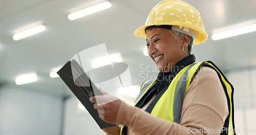 Image of Engineering, woman and tablet at construction site inspection, building development and industrial renovation. Excited manager on digital tech, design software and architecture planning in warehouse