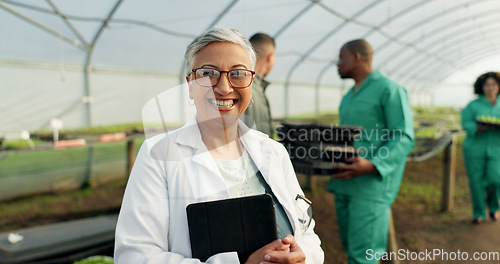 Image of Portrait, botanist and happy woman at greenhouse with tablet tech for science at farm, plant and ecology. Face, smile and mature scientist at nursery for agriculture in glasses for research in Mexico