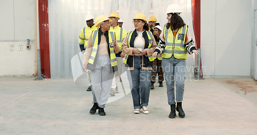 Image of Engineering group, manager walking and warehouse inspection, teamwork and talking of project management. Industrial people, leader or women with discussion for architecture or construction building