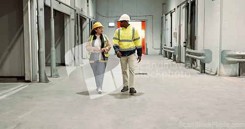Image of Engineer woman, man and walking in warehouse for planning discussion for manufacturing, logistics or industry. Teamwork, thinking and brainstorming for vision, supply chain and commerce in factory