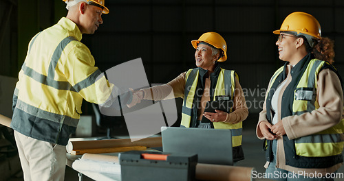 Image of Engineering team, factory people and handshake for manufacturing agreement, construction deal or collaboration. Greeting, warehouse project and partner shaking hands for hello, welcome or thank you