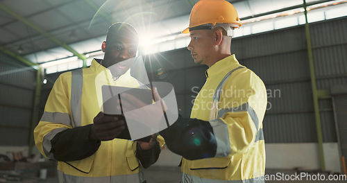 Image of Man, team and tablet at warehouse for engineering, research or planning storage in construction. Male person, engineer or contractor working on project plan or maintenance in teamwork with technology