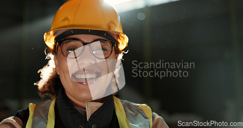 Image of Engineer woman, smile and portrait in warehouse for logistics, supply chain or commerce at plant. Employee, helmet and happy in reflective gear with safety at shipping workshop, factory or storage