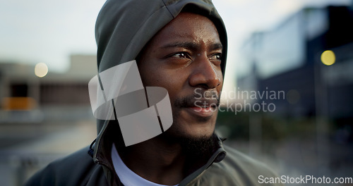 Image of Fitness, face and thinking, black man in city on rest from morning workout in hoodie. Relax, breathing and tired African athlete on calm urban exercise with fatigue, reflection and outdoor fresh air.