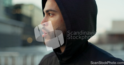 Image of Fitness, face and thinking, man in city on rest from morning workout challenge in hoodie. Relax, breathing and tired athlete on calm urban exercise with fatigue, reflection and outdoor fresh air.