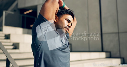 Image of Man, athlete or stretching arms at stairs for exercise, workout or wellness outdoor by building. Urban fitness, person or warm up for power and performance with strength, training and health by steps