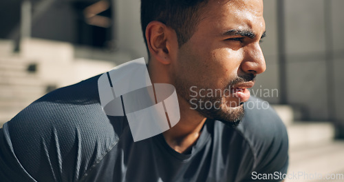 Image of Face, fitness and a tired sports man outdoor in the city for commitment to health or wellness. Fatigue, breathing and sweating with an exhausted young athlete in an urban town for exercise training