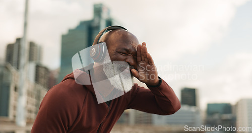 Image of Senior, fitness and tired man in a city with music headphones for intense, cardio or training outdoor Sport, fatigue and elderly male runner stop for break, breathe and sweating from running workout
