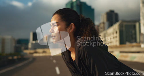 Image of Woman, runner and breathe in road for fitness, exercise or wellness with city background or nature. Athlete, person and tired or break for workout, training and healthy body with sportswear in town