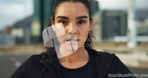 Image of Fitness, city portrait and woman exercise, determined and ready for outdoor cardio, workout commitment or sports. Sweaty face, road and active athlete, runner or person for street training challenge