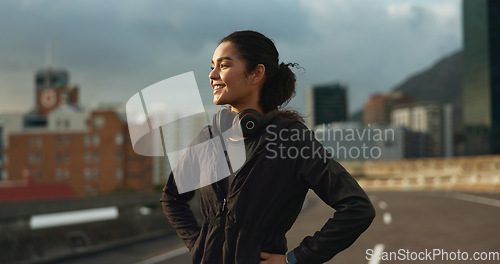 Image of Training, city smile and outdoor woman looking at view, buildings and happy for morning cardio, wellness or workout. Happiness, fitness and urban athlete, runner or person exercise in Chicago, USA