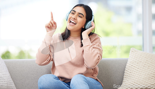 Image of Singing and listening to music or audio with headphones musician and vocal student streaming songs at home. Young, creative and happy woman can sing song after practicing from melody and sound