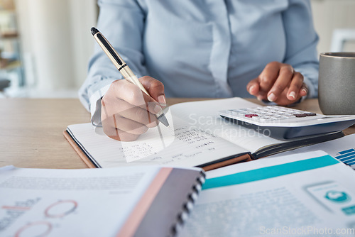 Image of Accounting, bank payment and payroll with a finance manager, accountant or business woman using a calculator in her office. Debt, tax and writing in a notebook for banking with a female accountant