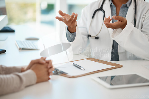 Image of Hands of medical doctor consulting with patient, giving healthcare advice and discussing sickness sitting at a table at a hospital. Expert, professional and helping gp explaining healthcare problem