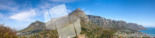 Image of Beautiful Table Mountain with lush greenery and nearby urban city in a wide angle landscape in summer. Scenic view of the nature in South Africas popular National landmark natural tourist destination