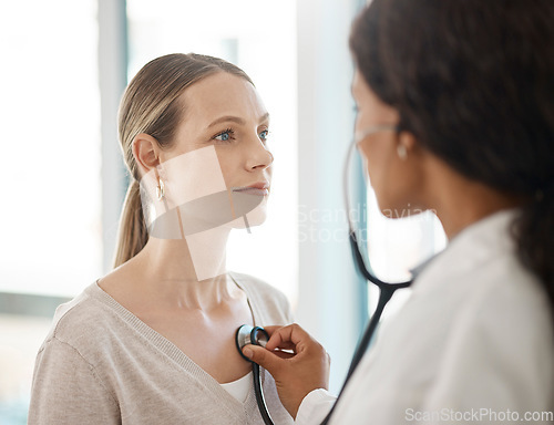 Image of Doctor listening to stethoscope heartbeat, patient breathing and lungs for healthcare checkup, test and consulting in hospital. Woman with medical screening from cardiology physician for tuberculosis