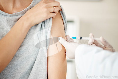 Image of Vaccine, injection and virus cure for covid, disease and pandemic illness from doctor, healthcare or medical professional. Closeup hands, arm and needle or syringe being injected into female patient