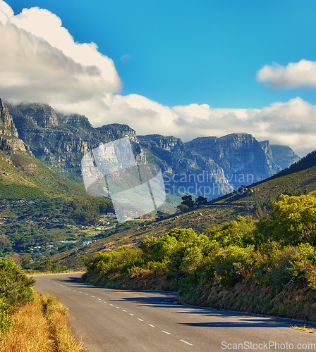 Image of Copy space with a mountain pass along the Twelve Apostles in Cape Town, South Africa against a cloudy sky background over a peninsula. Calm and scenic landscape to travel or explore on a road trip