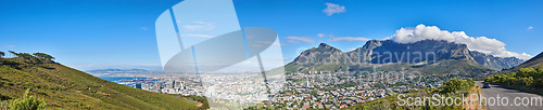 Image of Wide angle of Cape Town and mountain landscape on a sunny day. Beautiful view of a city against a blue horizon. A popular travel destination for tourists and hikers, on Table Mountain, South Africa
