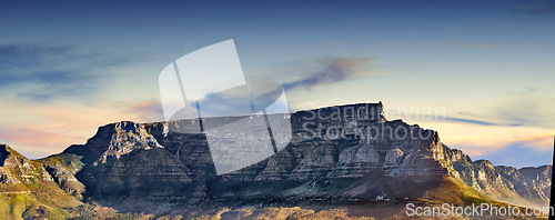 Image of Copy space with scenic landscape of Table Mountain in Cape Town with cloudy blue sky background. Steep rocky mountainside with green valley. Breathtaking and magnificent views of the beauty in nature