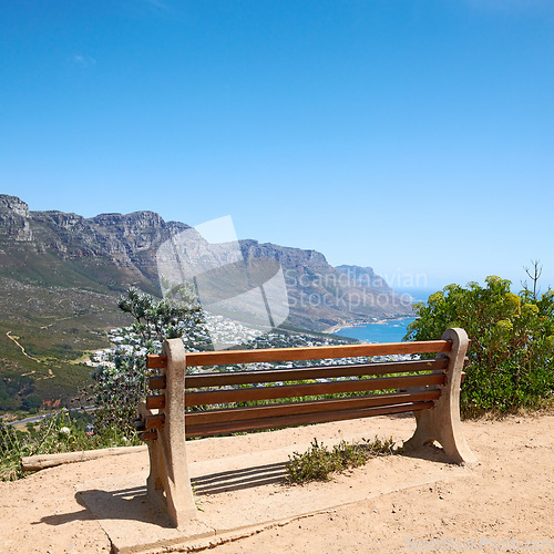 Image of Bench with a beautiful view of the mountain and sea against a clear blue sky background with copy space. Landscape of relaxing outdoor seating on cliff to enjoy zen moment in Cape Town, South Africa