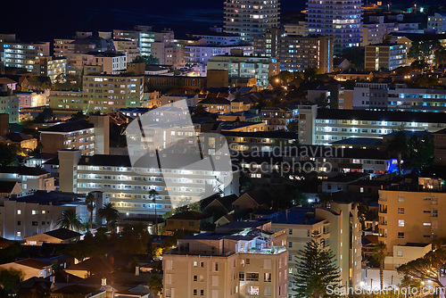 Image of Cape Town at night. Aerial view of urban construction in the evening. The landscape of an electrically lit up town at nighttime. Night cityscape of the beautiful city of Cape Town in South Africa.