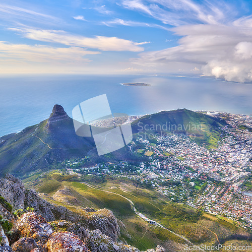 Image of Aerial landscape view of Lions Head and surroundings in Cape Town, South Africa. Scenic natural landmark of a popular mountain against a cloudy blue sky in a beautiful urban city from above