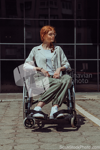 Image of In front of a modern corporate building, a young woman sitting in a wheelchair confidently, symbolizing empowerment, inclusivity, and the strength to overcome challenges in the business world