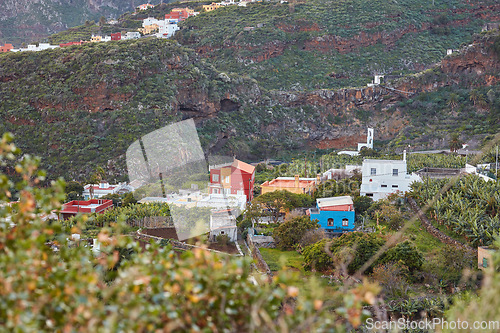 Image of A small vibrant town or village surrounded by lush green plants or nature on an overcast afternoon in the mountains. View of the beautiful city of Los Llanos, La Palma, and the Canary Islands