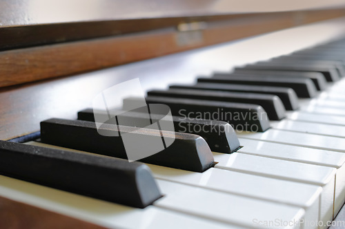 Image of Closeup of a vintage piano and keyboard for music. Zoom in on an antique and classic musical instrument for a talented musician to play or compose songs and a melody during a performance concert