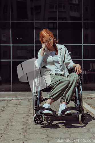 Image of In front of a modern corporate building, a young woman sitting in a wheelchair confidently, symbolizing empowerment, inclusivity, and the strength to overcome challenges in the business world