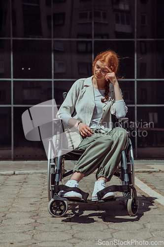 Image of In front of a modern corporate building, a young woman sitting in a wheelchair confidently, symbolizing empowerment, inclusivity, and the strength to overcome challenges in the business world