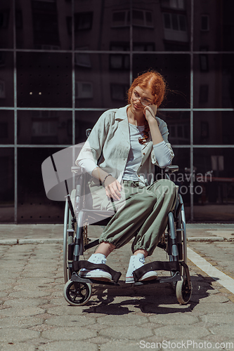 Image of In front of a modern corporate building, a young woman sitting in a wheelchair confidently, symbolizing empowerment, inclusivity, and the strength to overcome challenges in the business world